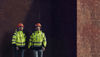 Two Stena Metall Group employees - one male and one female - in hi-vis protective clothing