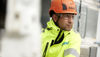 Close-up shot of a Stena Metall Group employee at work wearing hi-vis protective gear.