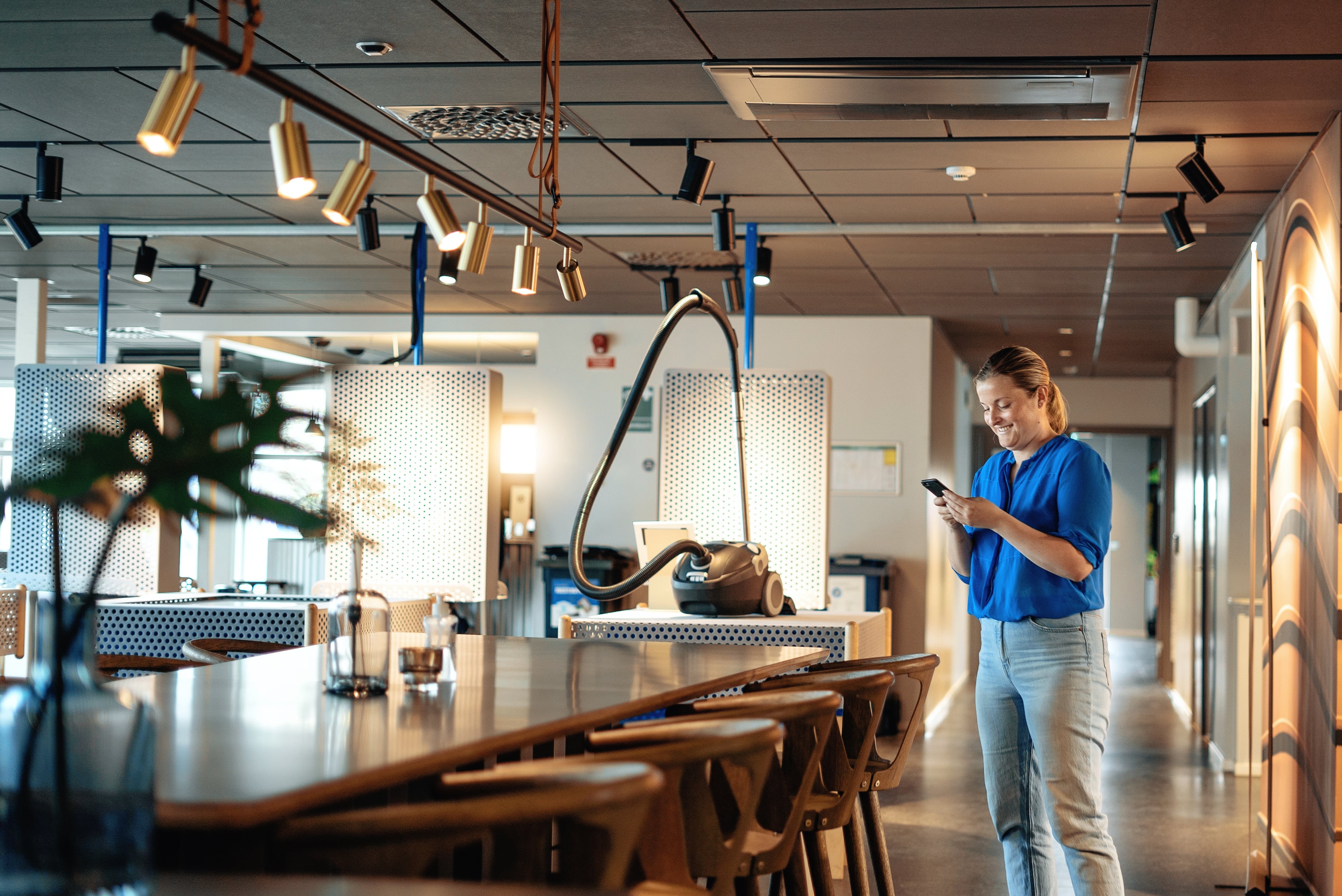 Woman reading on her phone at Stena Nordic Recycling Center