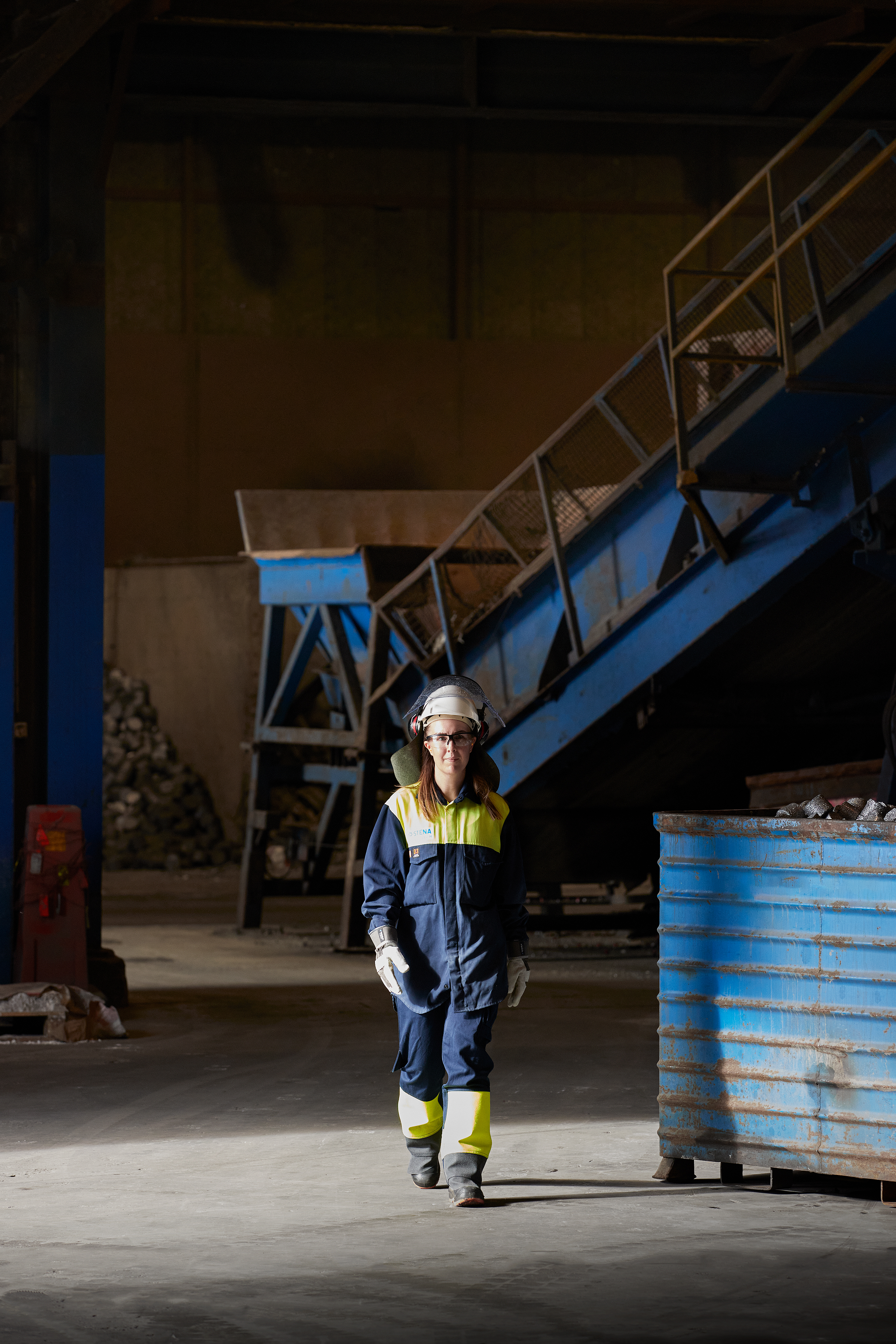 Stena Aluminium employee walking through a facility