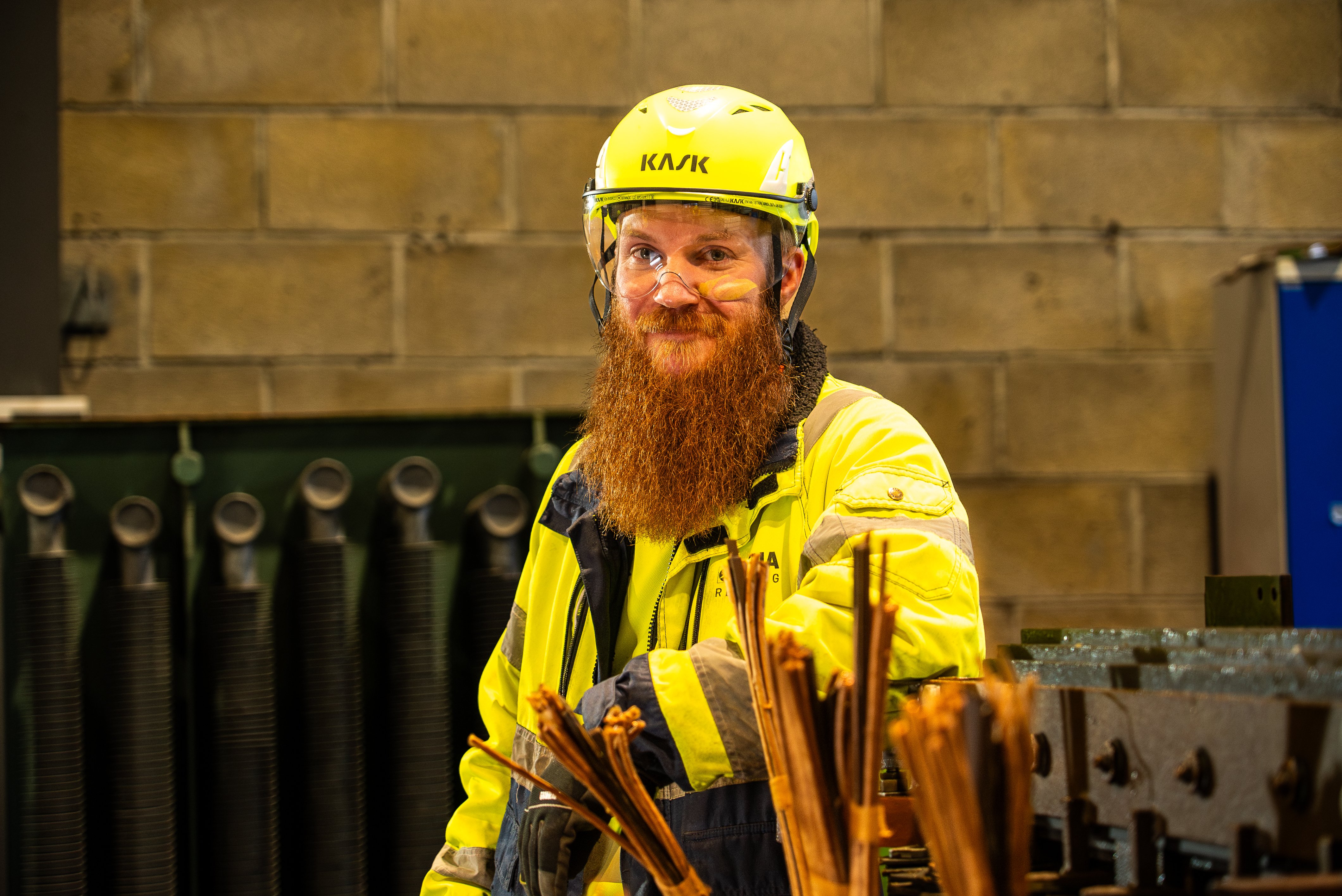 Ole Hansen, a male Stena Recycling production worker in high-vis protection gear in the production facility in Bergen, Norway. Inclusion builds strong teams.