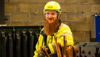 Ole Hansen, a male Stena Recycling production worker in high-vis protection gear in the production facility in Bergen, Norway. Inclusion builds strong teams.