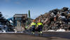 Two male Stena Recycling employees work outdoors at the Pori recycling facility in Finland. The shredder in the background is used to process metal scrap into smaller pieces. The work includes operating heavy machinery and vehicles. The safety issues are therefore high on the agenda and involve everyone. 