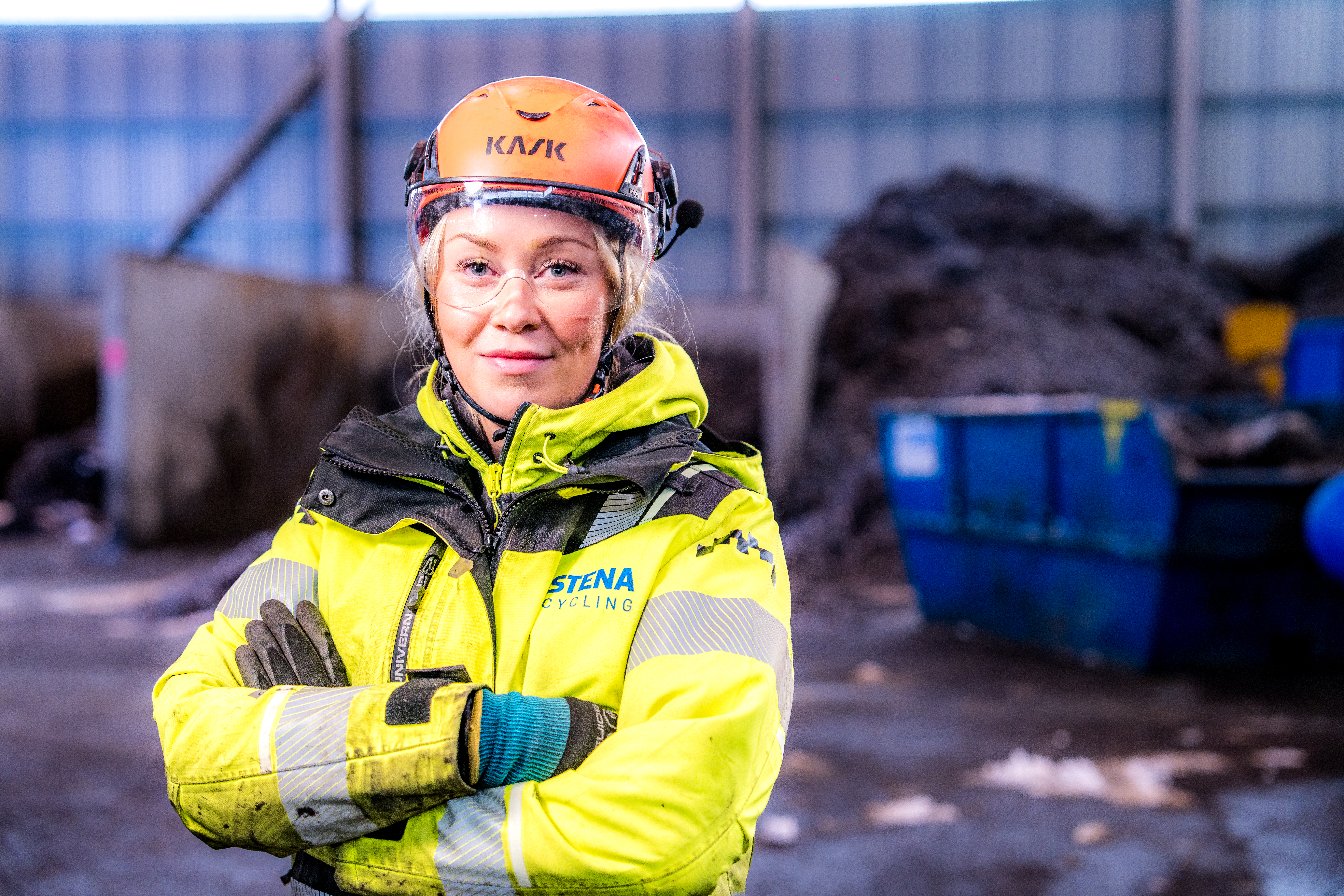 Lina Svahn, dressed in safety gear, used to work as an accountant but loves her job as a production worker.