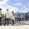 A Stena Metall Group employee discusses a project with a customer on-site.